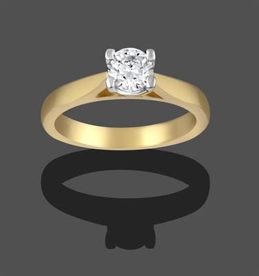 Lot 2168 - An 18 Carat Gold Diamond Solitaire Ring, a round brilliant cut diamond in a yellow claw setting, to