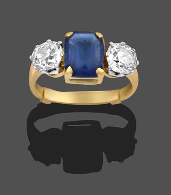 Lot 2173 - A Blue Glass and Diamond Three Stone Ring, the emerald-cut blue glass in yellow claw settings,...