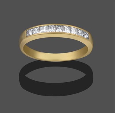 Lot 2177 - An 18 Carat Gold Diamond Half Hoop Ring, nine princess cut diamonds in a yellow channel setting, to