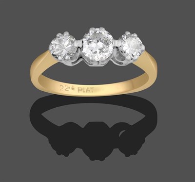 Lot 2181 - A Diamond Three Stone Ring, the graduated round brilliant cut diamonds in white double claw...