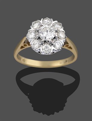 Lot 2187 - An 18 Carat Gold Diamond Cluster Ring, the central round brilliant cut diamond within a border...