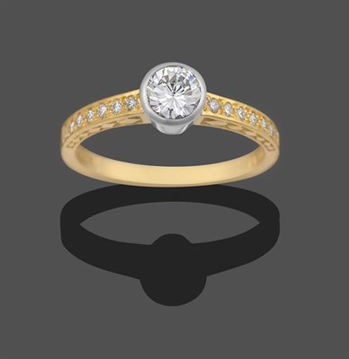Lot 2189 - An 18 Carat Gold Diamond Solitaire Ring, a round brilliant cut diamond in a white rubbed over...