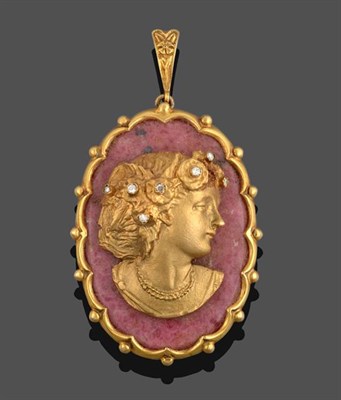 Lot 2199 - A Rhodonite and Diamond Cameo Pendant, the oval rhodonite plaque with an applied yellow metal...