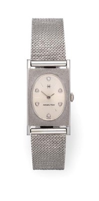 Lot 2206 - A Lady's 14 Carat White Gold Rectangular Shaped Wristwatch, signed Hamilton, circa 1950,...