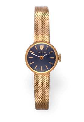 Lot 2297 - A Lady's 9 Carat Gold Wristwatch, signed Tudor, circa 1970, lever movement signed, dark blue...