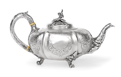 Lot 2345 - A Victorian Silver Teapot, by John Samuel Hunt, London, 1849, melon-fluted and on three cast branch