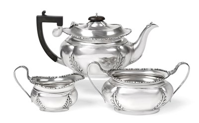 Lot 2459 - A Three-Piece George V Silver Tea-Service, by Nathan and Hayes, Chester, 1912 and 1913, each...