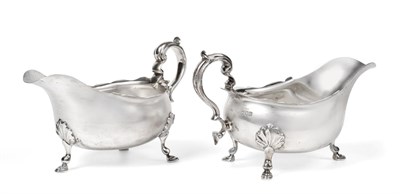 Lot 2464 - A Pair of Edward VII Silver Sauceboats, by Thomas Bradbury and Sons Ltd., London, 1909, each in the