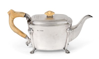 Lot 2472 - A George VI Silver Teapot, by Stower and Wragg Ltd., Sheffield, 1938, oblong and on four scroll...