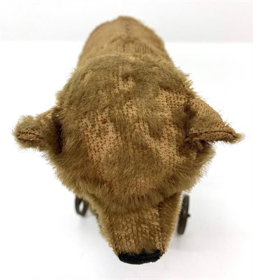 Lot 2002 - An Early 20th Century Steiff Pull Along Bear on Wheels, with jointed head, boot button eyes,...