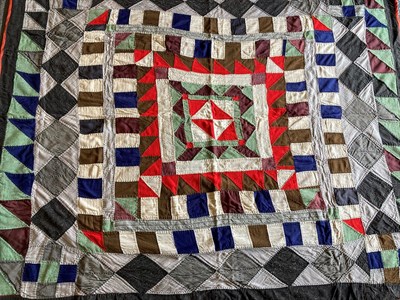 Lot 2009 - Late 19th Century Wool Country Quilt, worked in frames of striking colours with a central...