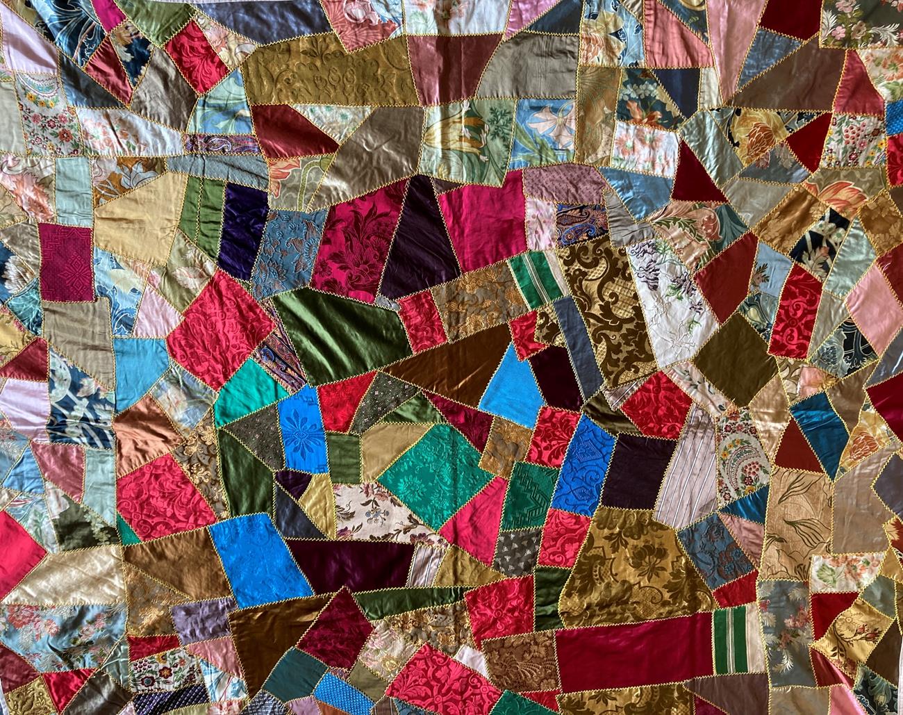 Lot 2010 - Late 19th Century Silk Brocade Crazy Patchwork Bed Cover, incorporating a variety of colours,...