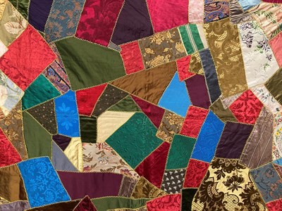 Lot 2010 - Late 19th Century Silk Brocade Crazy Patchwork Bed Cover, incorporating a variety of colours,...