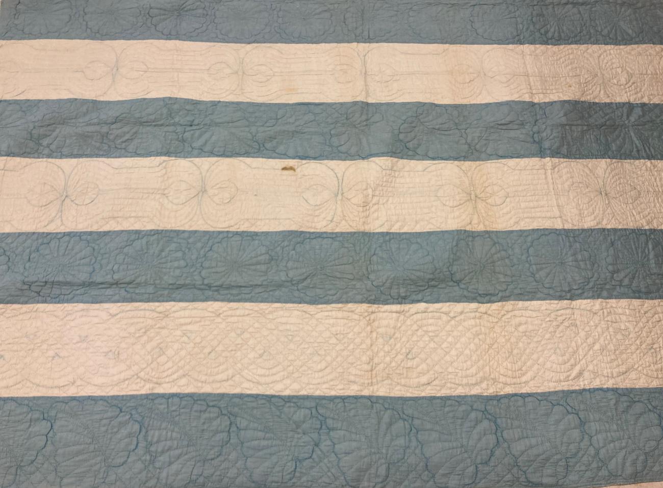 Lot 2013 - Late 19th Century Blue and White Strippy Quilt, decoratively quilted overall with palm leaves...