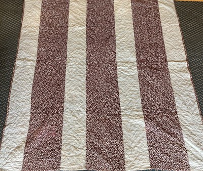 Lot 2014 - Early 20th Century North Country Strippy Quilt, in grey and mauve sprigged floral printed...