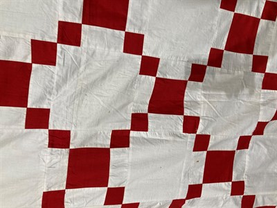 Lot 2017 - Late 19th Century Irish Chain Pattern Patchwork Bed Cover, in turkey red and white, within a...