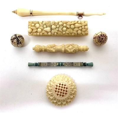 Lot 2019 - 19th Century Ivory Sewing Accessories, including a Dieppe ivory needle case carved with fruit,...