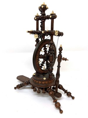 Lot 2020 - Circa 1900 Black Forest Treen Miniature Spinning Wheel, with baluster turned uprights and...