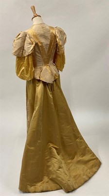 Lot 2028 - Late 19th Century Yellow Silk Two Piece, comprising a fitted bodice with short gathered sleeves and