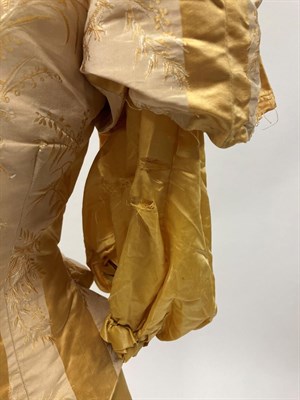 Lot 2028 - Late 19th Century Yellow Silk Two Piece, comprising a fitted bodice with short gathered sleeves and