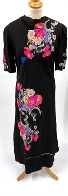 Lot 2035 - Circa 1920/30s Evening Dresses, comprising a black silk sleeveless dress with drop waist,...