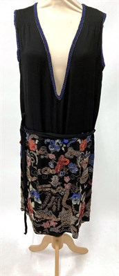Lot 2042 - Circa 1920s Black Silk Shift Dress, with deep V to the front trimmed with blue and silver...