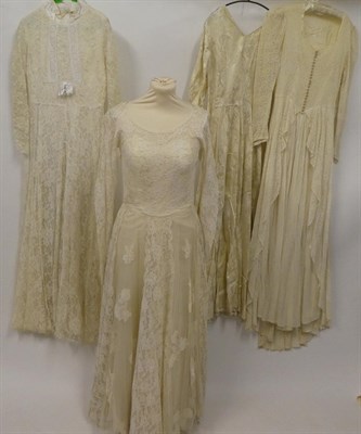 Lot 2047 - Assorted 1930/1950s Wedding Dresses, including a plain cream silk long sleeve dress with a v...