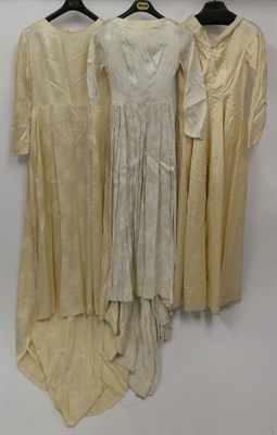 Lot 2047 - Assorted 1930/1950s Wedding Dresses, including a plain cream silk long sleeve dress with a v...