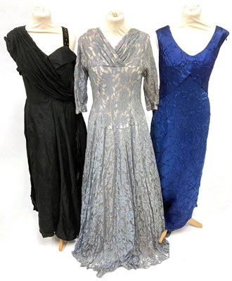 Lot 2054 - Circa 1950s Ladies' Evening Dresses, comprising Sambo Fashions pale blue brocade dress with...