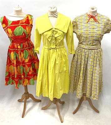 Lot 2057 - Assorted Circa 1950s Ladies' Printed Cotton Day Dresses, comprising a pink and floral striped...