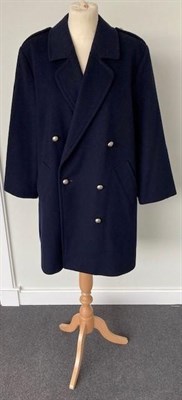 Lot 2073 - A Burberrys Lady's Dark Blue Wool Double Breasted Military Style Coat, 1980s/1990s, with silver...