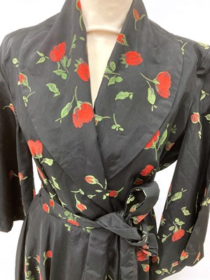 Lot 2079 - 20th Century Robes and Kimonos, including a black full length long sleeved house coat decorated...