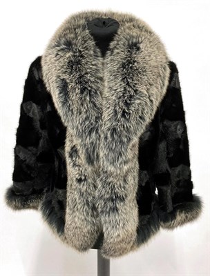 Lot 2086 - A Black Mink and Silver Fox Fur Jacket, with bracelet length sleeves, the mink bodice trimmed...