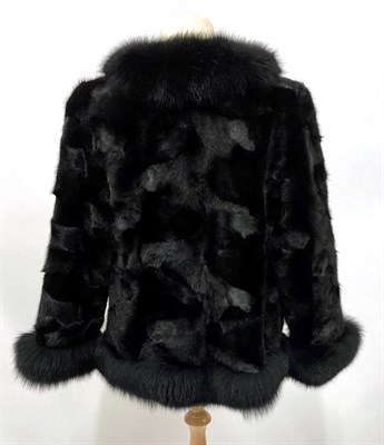 Lot 2087 - A Black Mink and Fox Fur Jacket, with bracelet length sleeves, the mink bodice trimmed with fox fur