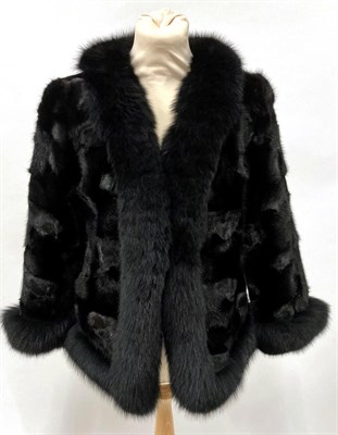 Lot 2087 - A Black Mink and Fox Fur Jacket, with bracelet length sleeves, the mink bodice trimmed with fox fur