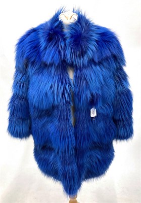 Lot 2091 - An Italian Dyed Blue Fox Fur Coat, with 3/4 length sleeves and slit pockets, lined in floral silk