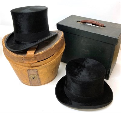 Lot 2093 - Dunn & Co Black Silk Top Hat, in a brown leather top hat case with red fabric lining; Austin...