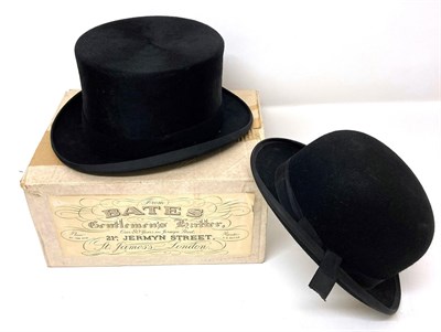 Lot 2098 - Bates Hatters, London Black Silk Top Hat (in a later box) and a Lock & Co Black Bowler Hat (2)