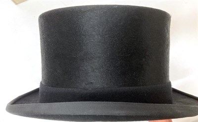 Lot 2098 - Bates Hatters, London Black Silk Top Hat (in a later box) and a Lock & Co Black Bowler Hat (2)