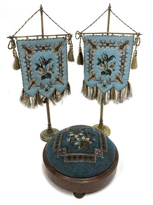 Lot 2106 - Pair of Late 19th Century Blue Floral Bead Work Table Top Face Screens, of floral design on a brass