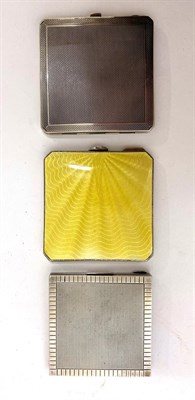 Lot 2122 - Three Silver and Enamel Mounted Hinged Compacts, including an engine turned compact by Crisford...