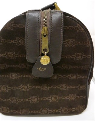 Lot 2158 - A Circa 1980s Céline Dark Brown Suede Duffle Handbag, printed with a 'CC' and chain pattern,...