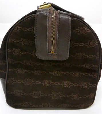 Lot 2158 - A Circa 1980s Céline Dark Brown Suede Duffle Handbag, printed with a 'CC' and chain pattern,...