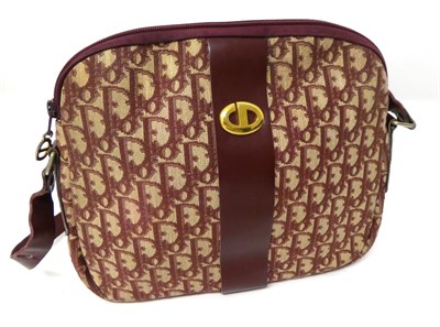 Lot 2159 - A Christian Dior Oblique Pattern Burgundy and Cream Shoulder Bag, with leather long adjustable...