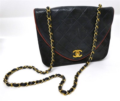 Lot 2166 - A  Circa 1994-1996 Chanel Dark Blue Leather Quilted Shoulder Bag, the D-shaped flap secured by gilt