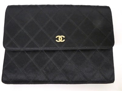 Lot 2167 - A Circa 1994-1996 Chanel Black Satin Quilted Clutch Bag, with diamante set gilt interlocking...
