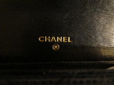Lot 2167 - A Circa 1994-1996 Chanel Black Satin Quilted Clutch Bag, with diamante set gilt interlocking...