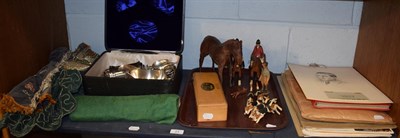 Lot 21 - A carved fox hunting pack; Edith Reynolds leather horse; Schweppes calendars; coins; plated...