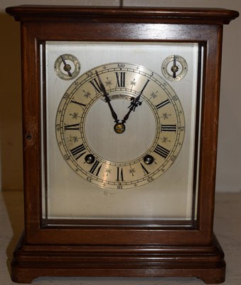 Lot 24 - A German mahogany quarter striking mantel clock, movement stamped W&H, retailed by Goldsmiths...