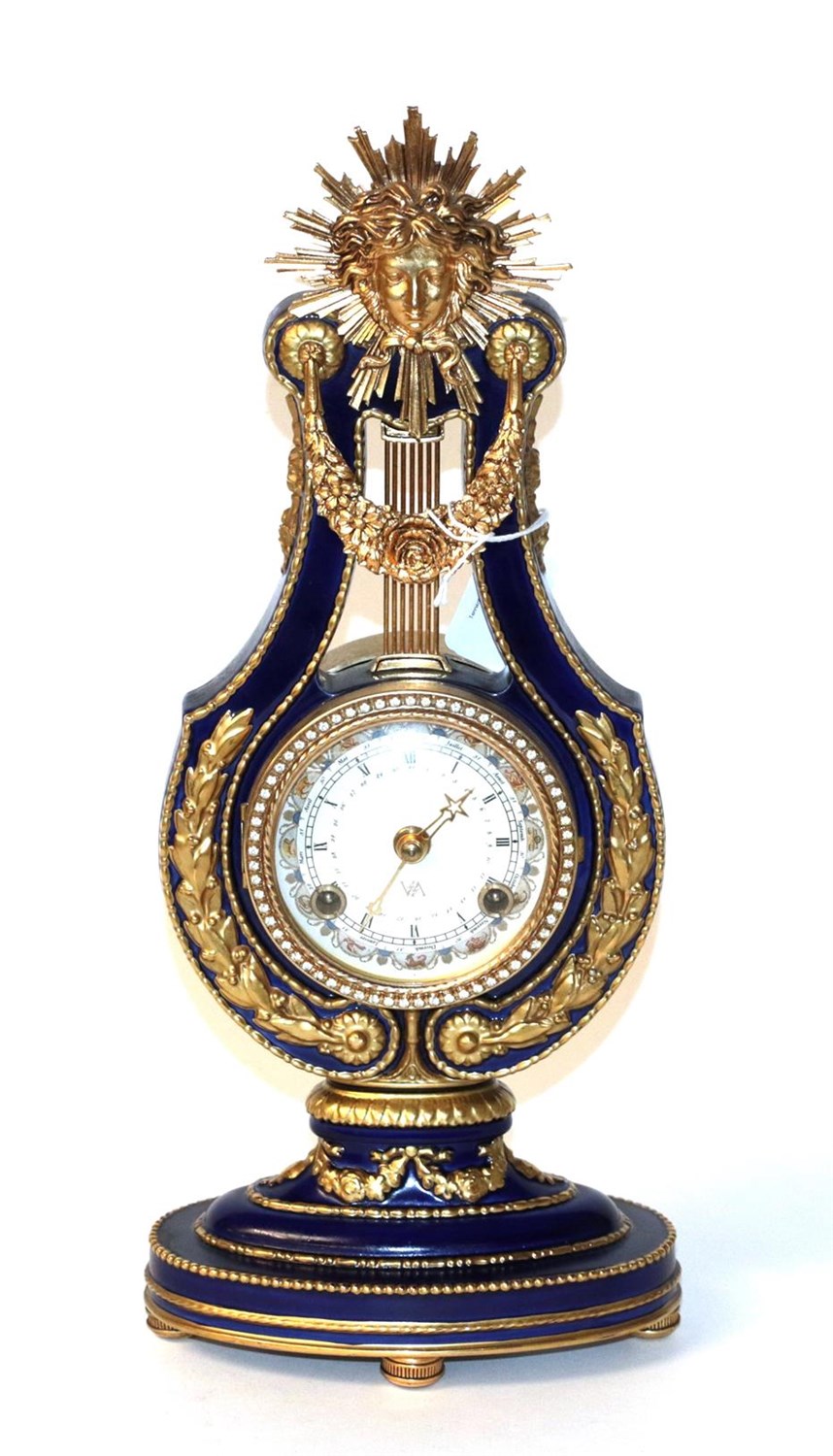 Lot 38 - A 20th century French style porcelain 'Marie Antionette' style lyre-form timepiece